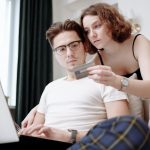 man typing credit card details